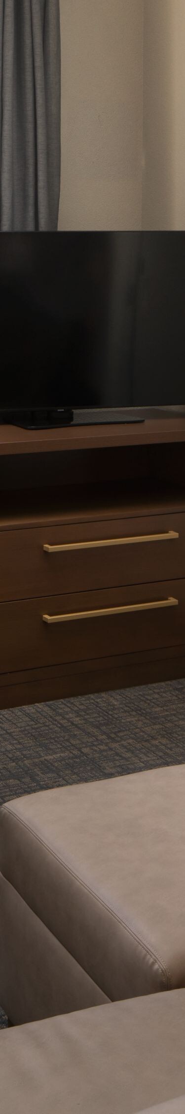 One-bedroom suite with living area and desk