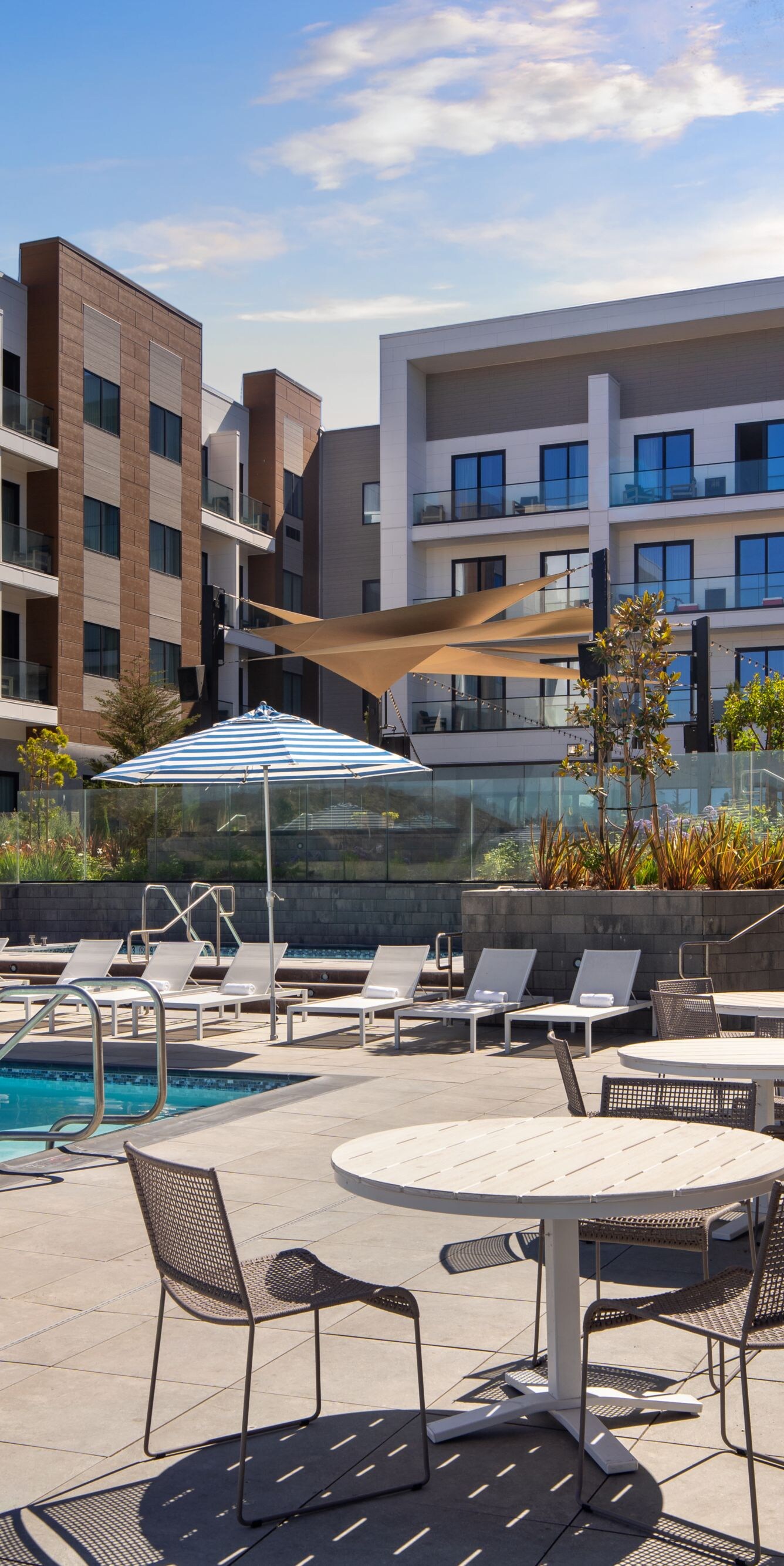 Outdoor pool with lounge chairs and patio
