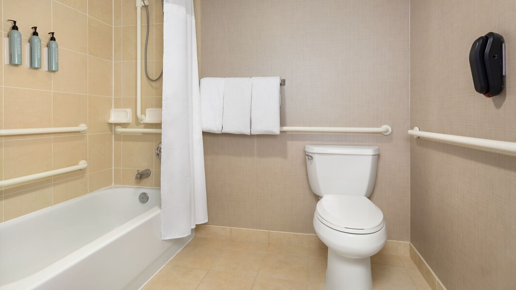ADA Bathroom facilities with shower bath combo.