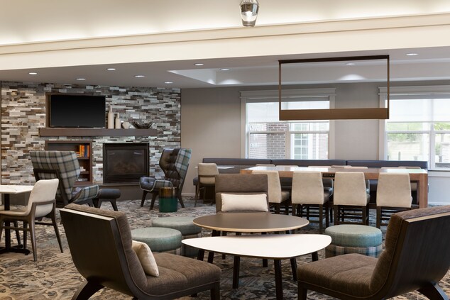 Lobby seating with fireplace, television, library