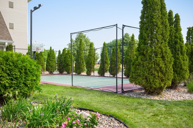 Tennis Court with basketball hoop