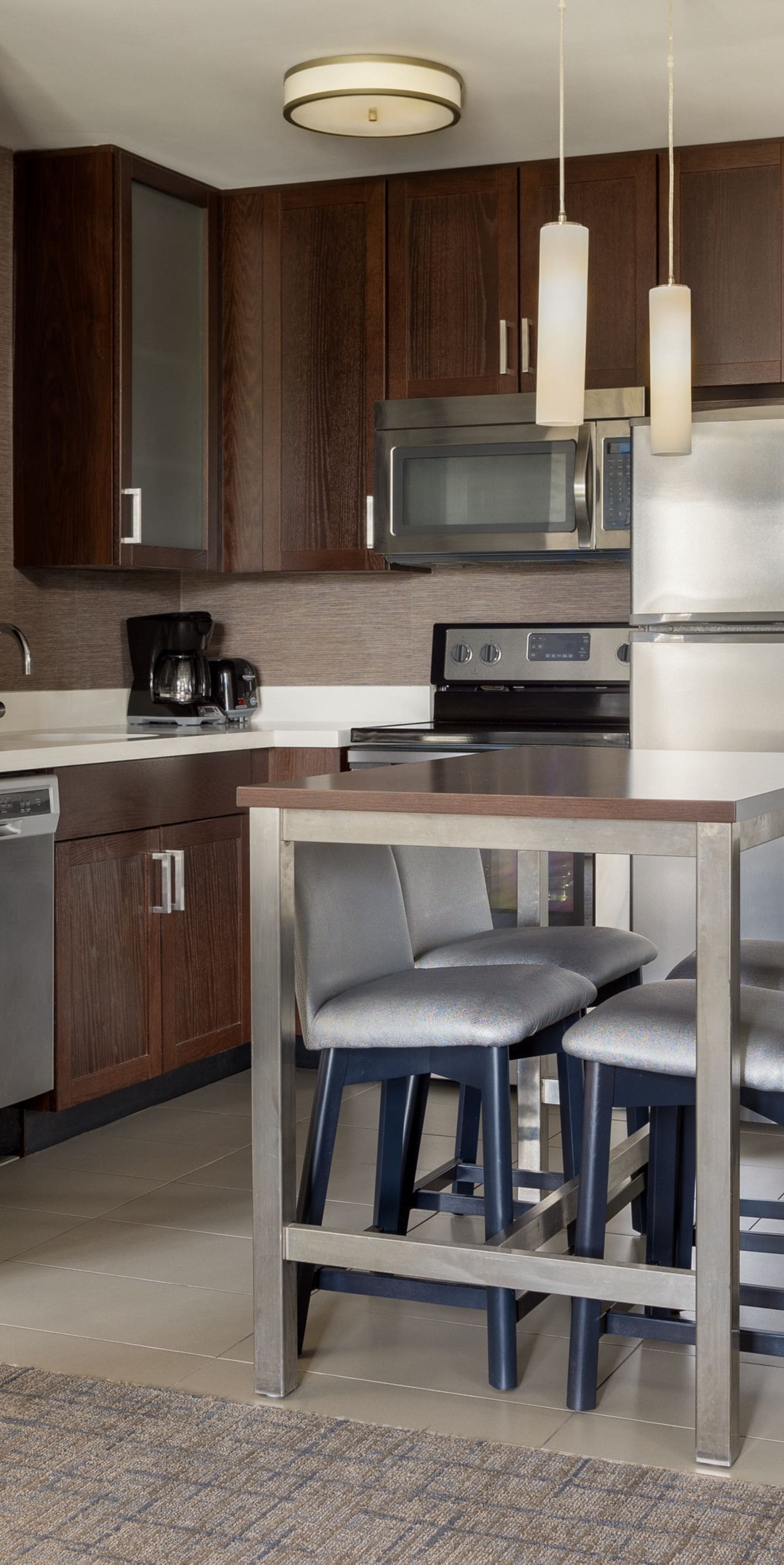 A fully appointed kitchen with seating for four