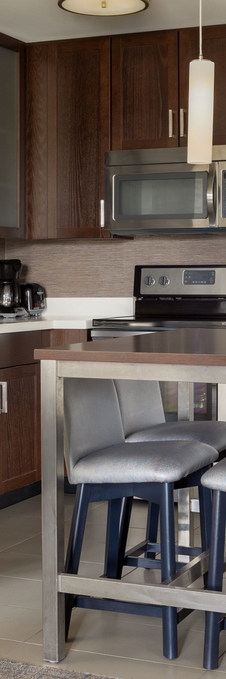 A fully appointed kitchen with seating for four