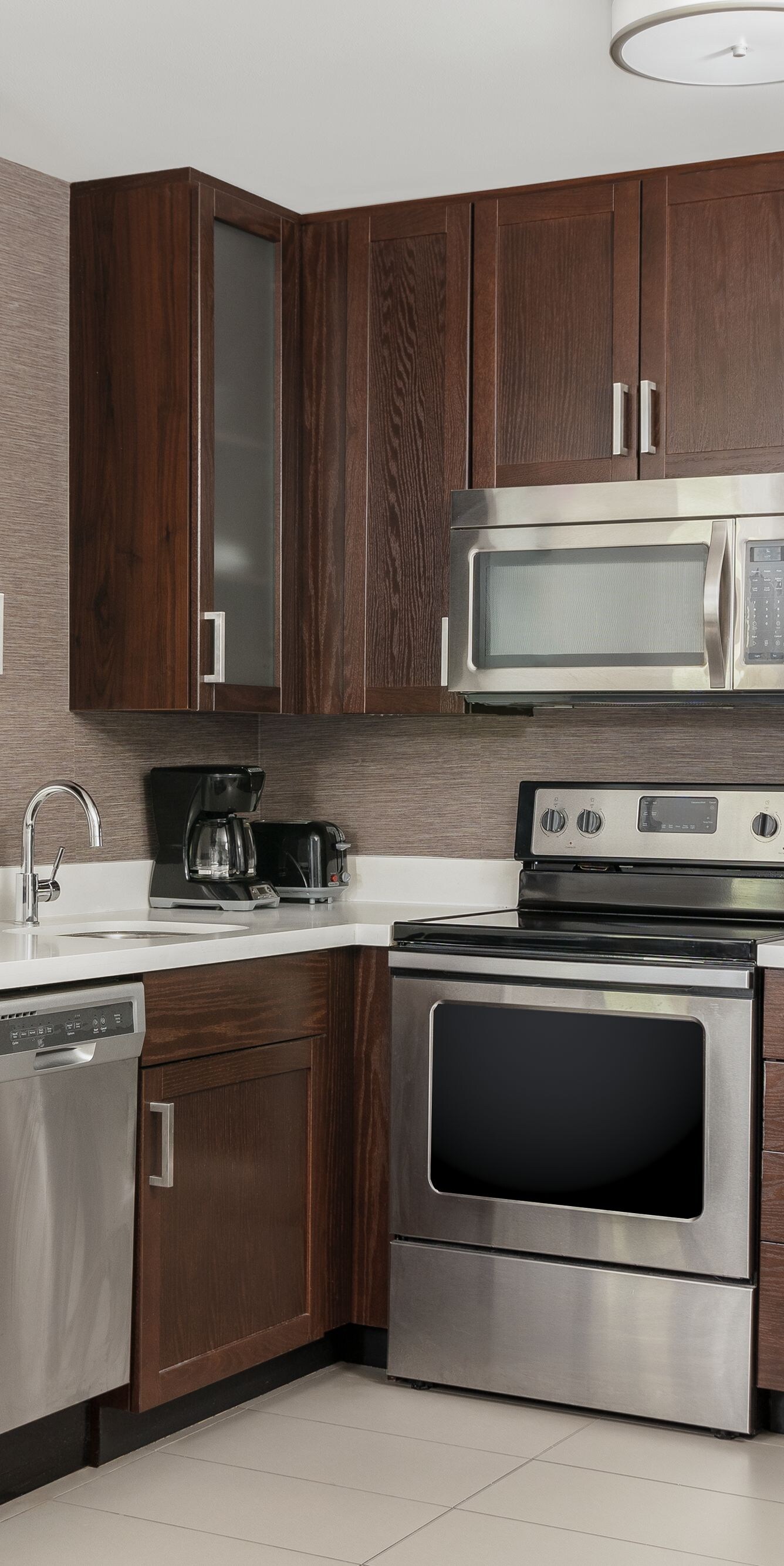 Kitchen with full size appliances and oven.