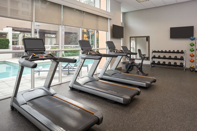 View of fitness center treadmills
