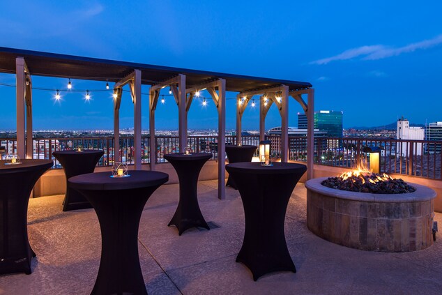 rooftop, skyline, tables, candles, fire pit