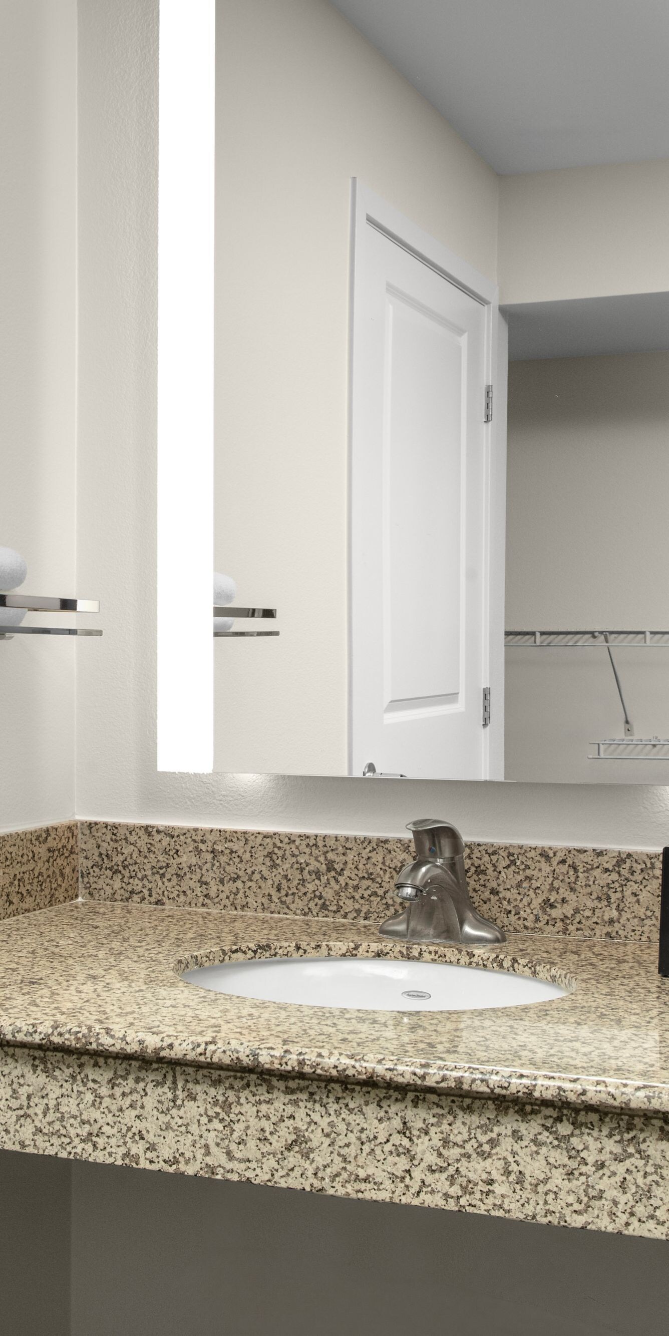 Accessible bathroom vanity with sink and mirror