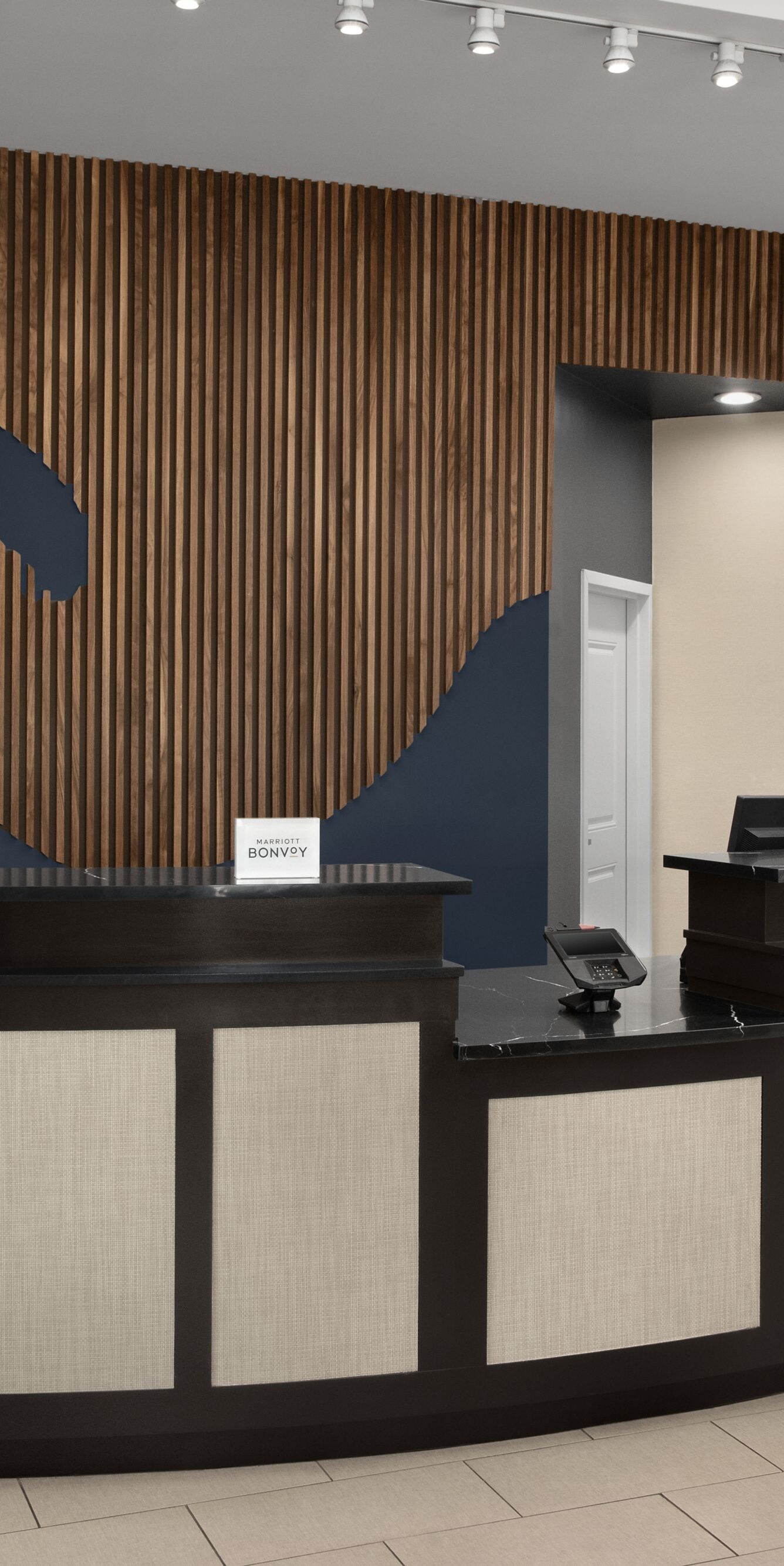 Front desk with wave design in background