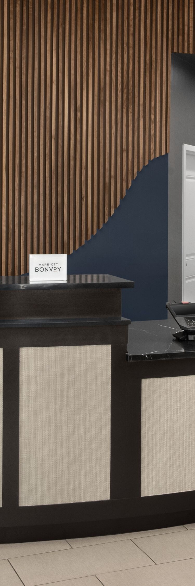 Front desk with wave design in background