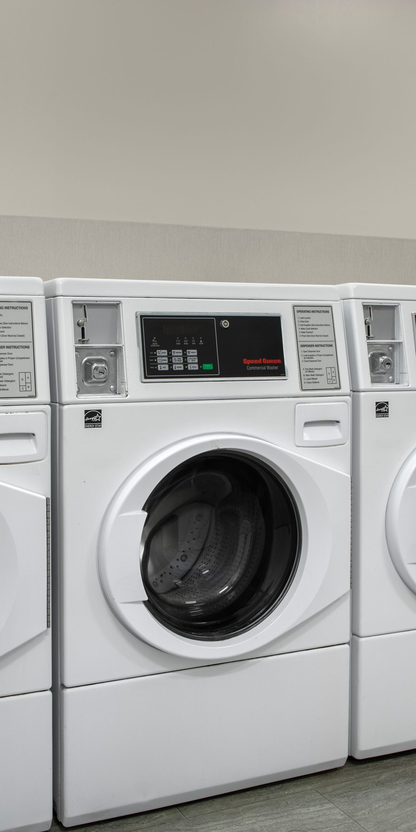 Laundry room with washers and dryers