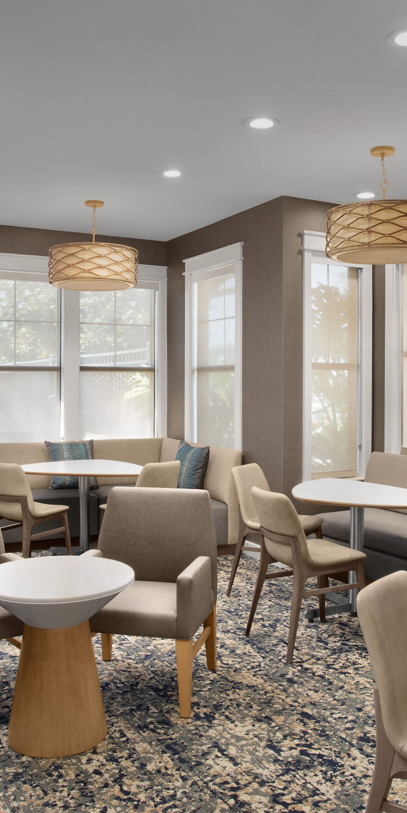 Hotel lobby seating area with tables and chairs