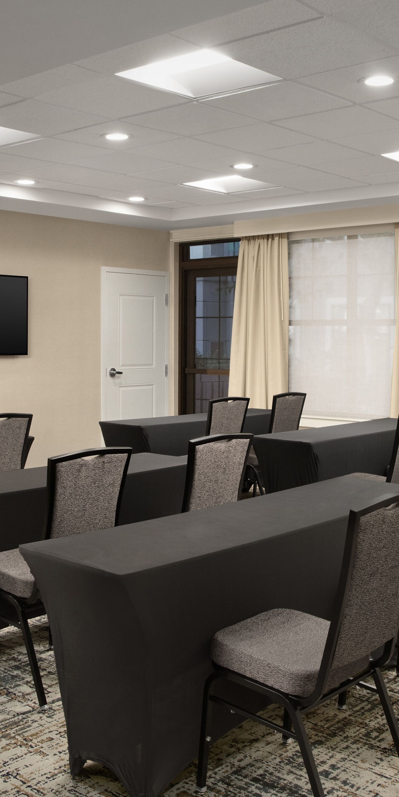 Meeting room set in classroom style with tables