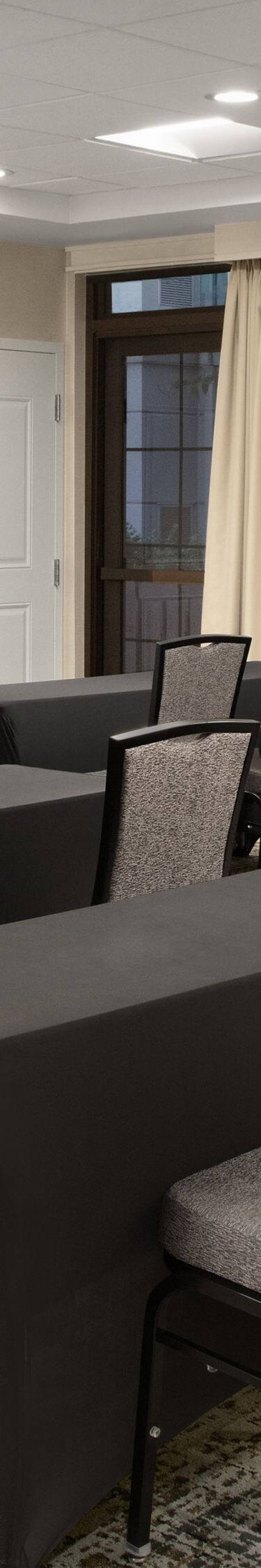 Meeting room set in classroom style with tables