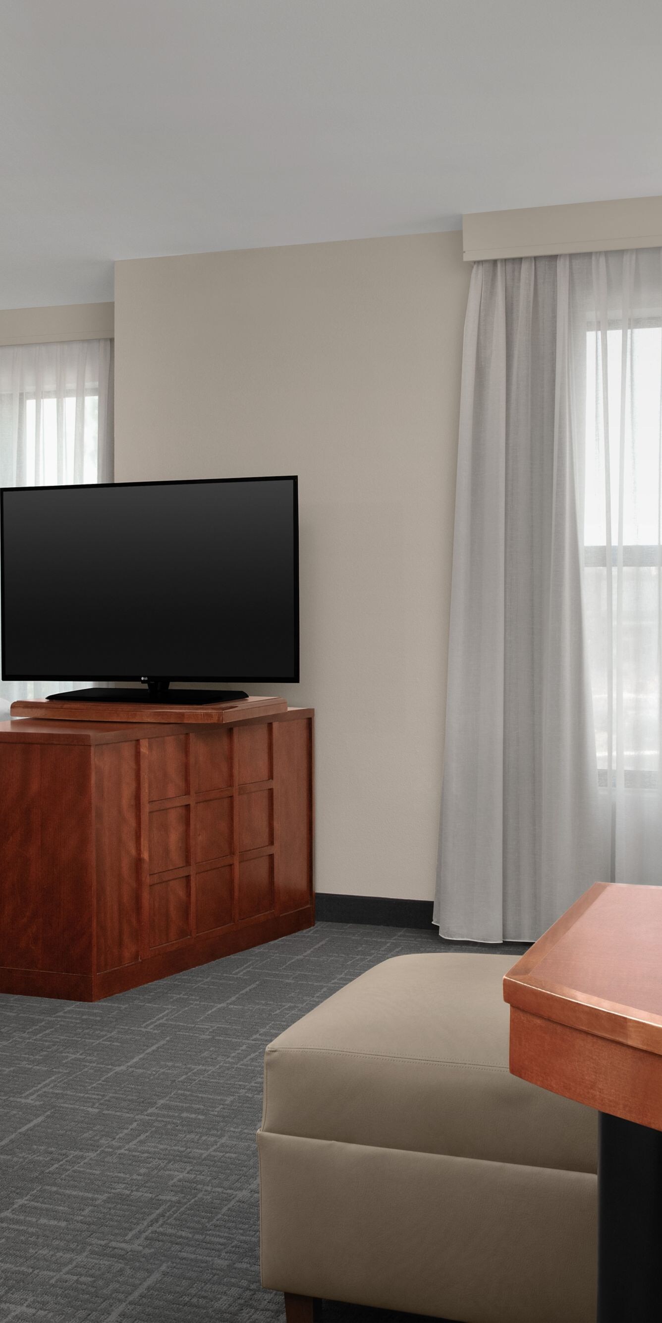 Studio suite with king bed, sofa, and TV