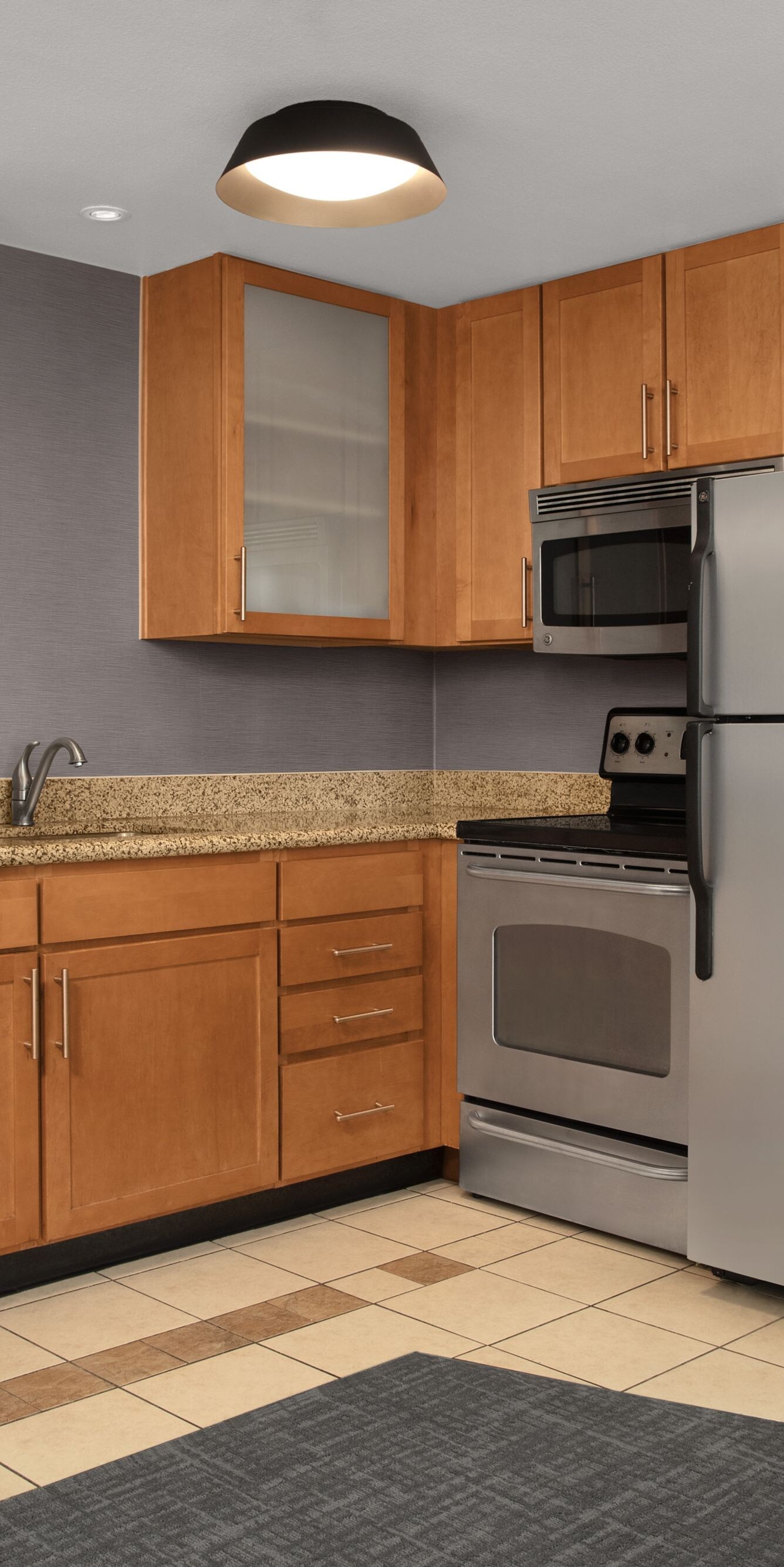 Large kitchen with appliances, cabinets and table