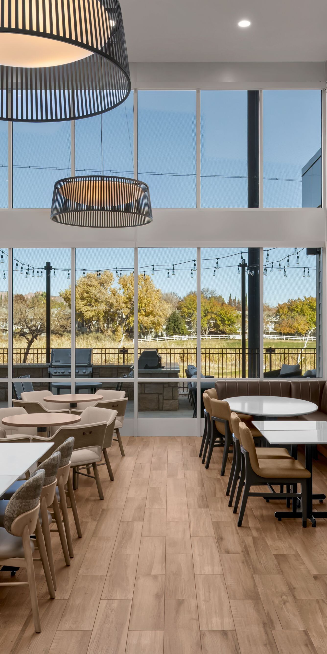 Dining area with large windows and wood floors