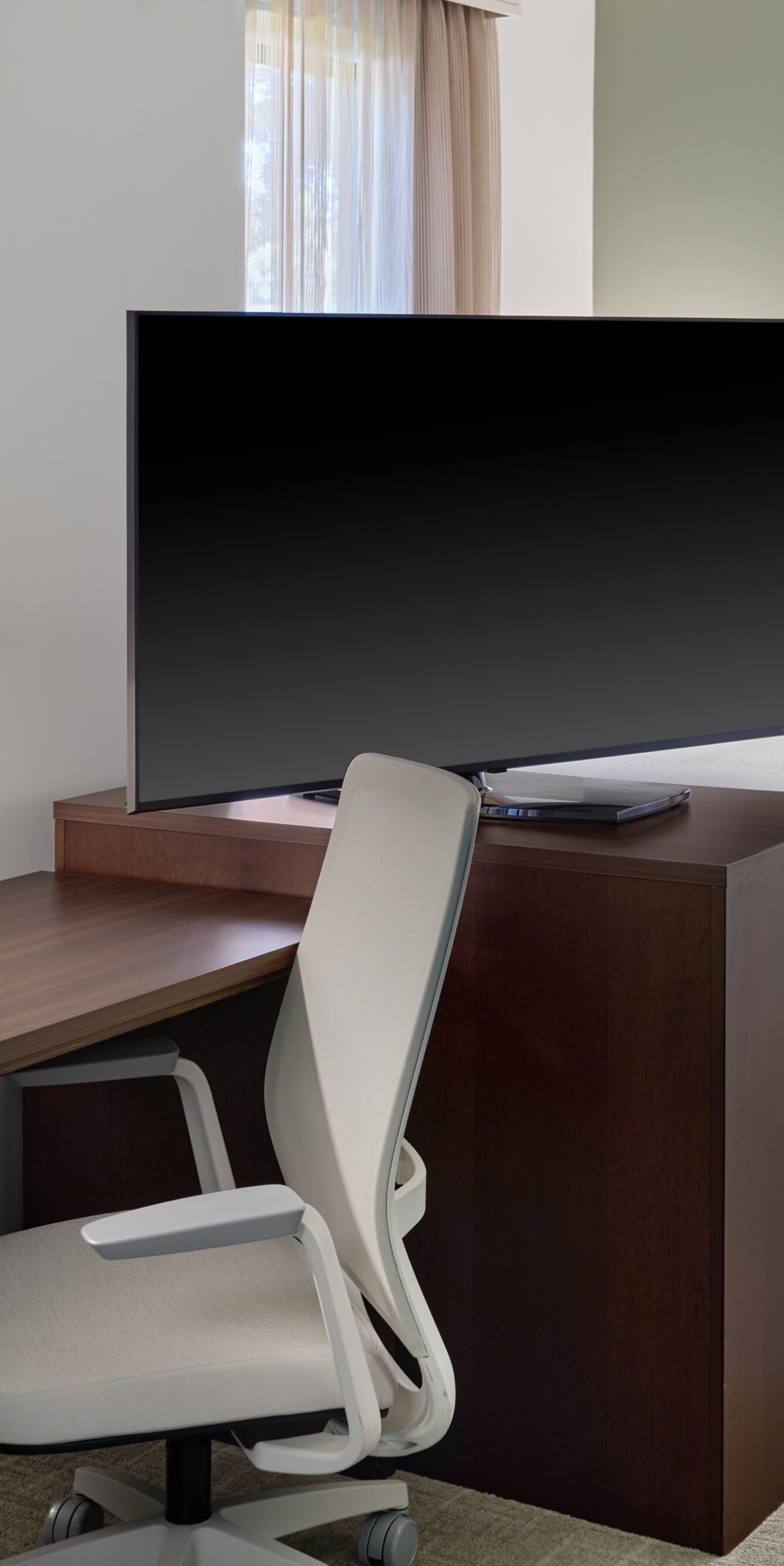 Studio suite desk and bedroom with rotating TV