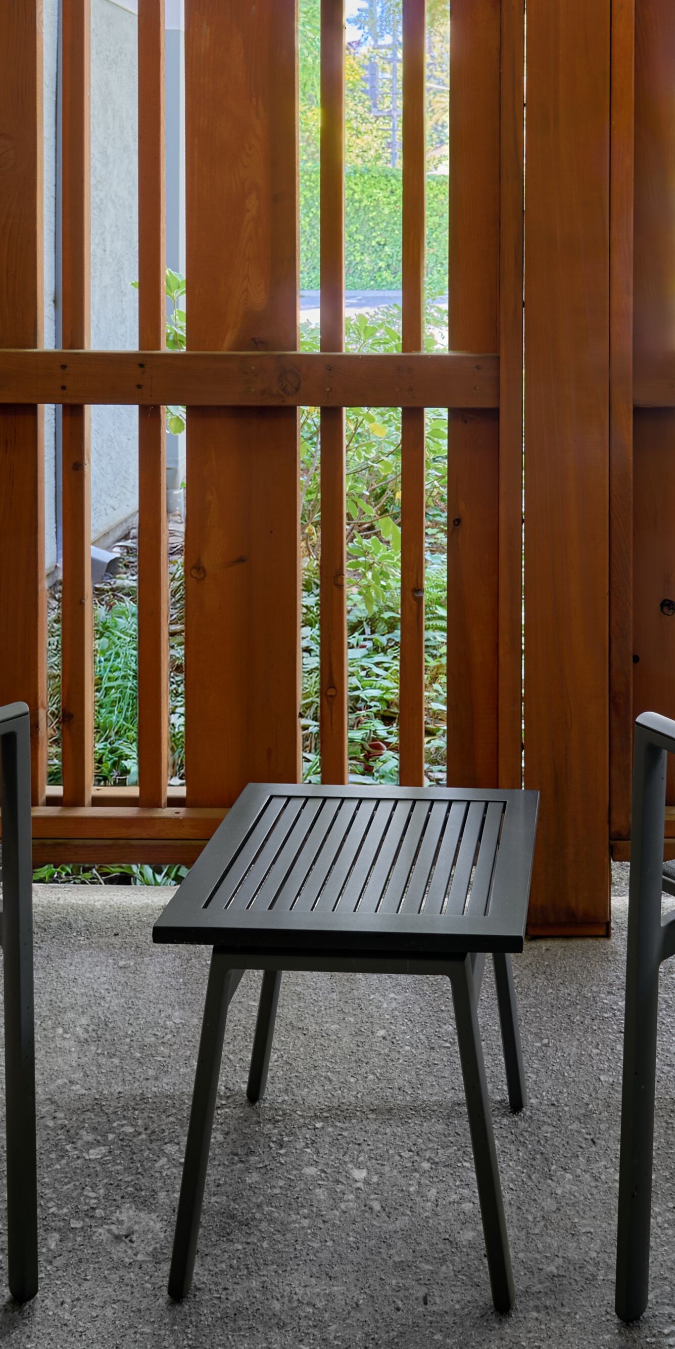 Fenced in patio with seating