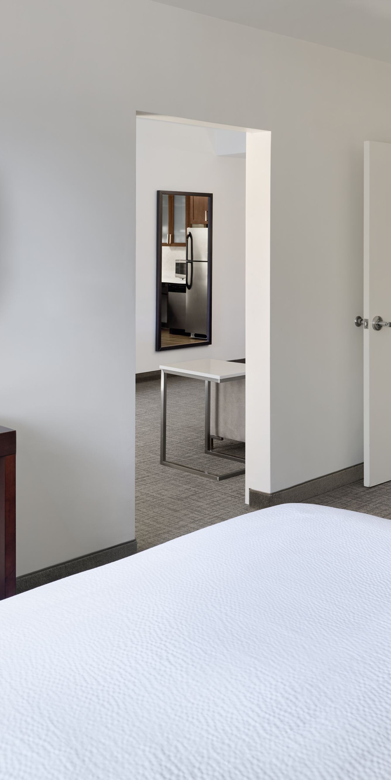 Suite bedroom with TV and entry area