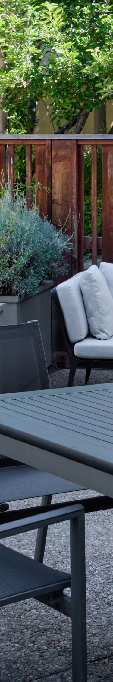 Spacious patio with dining table and sofa