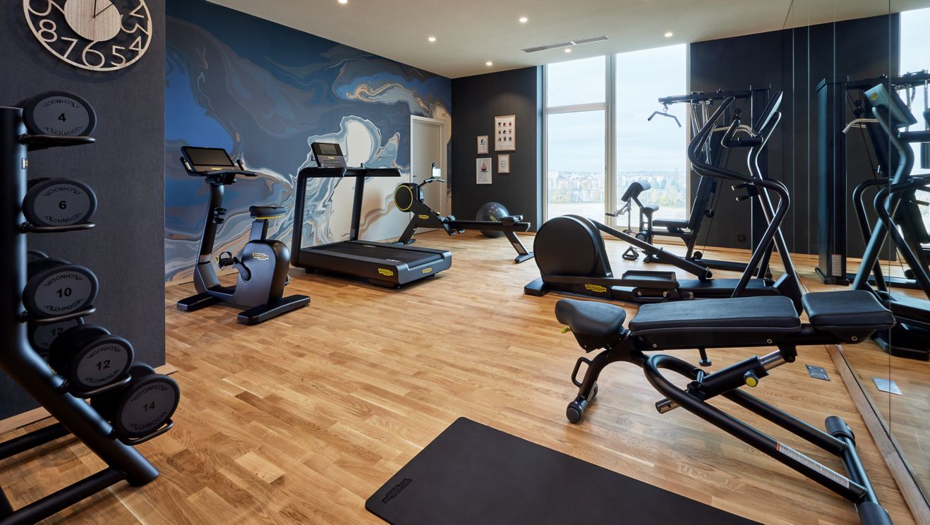 Fitness room with large windows 