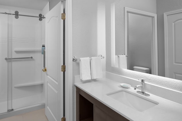 Vanity and shower in separate rooms