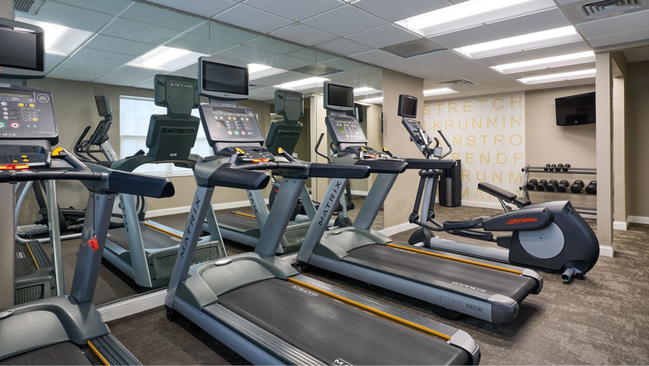 gym with treadmill, elliptical and weight
