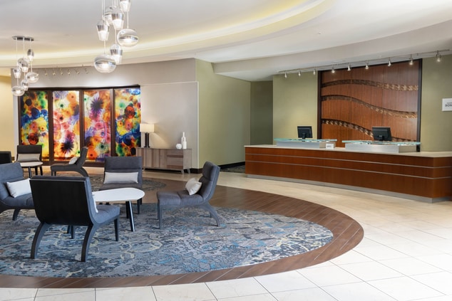 A spacious hotel lobby with comfortable seating.