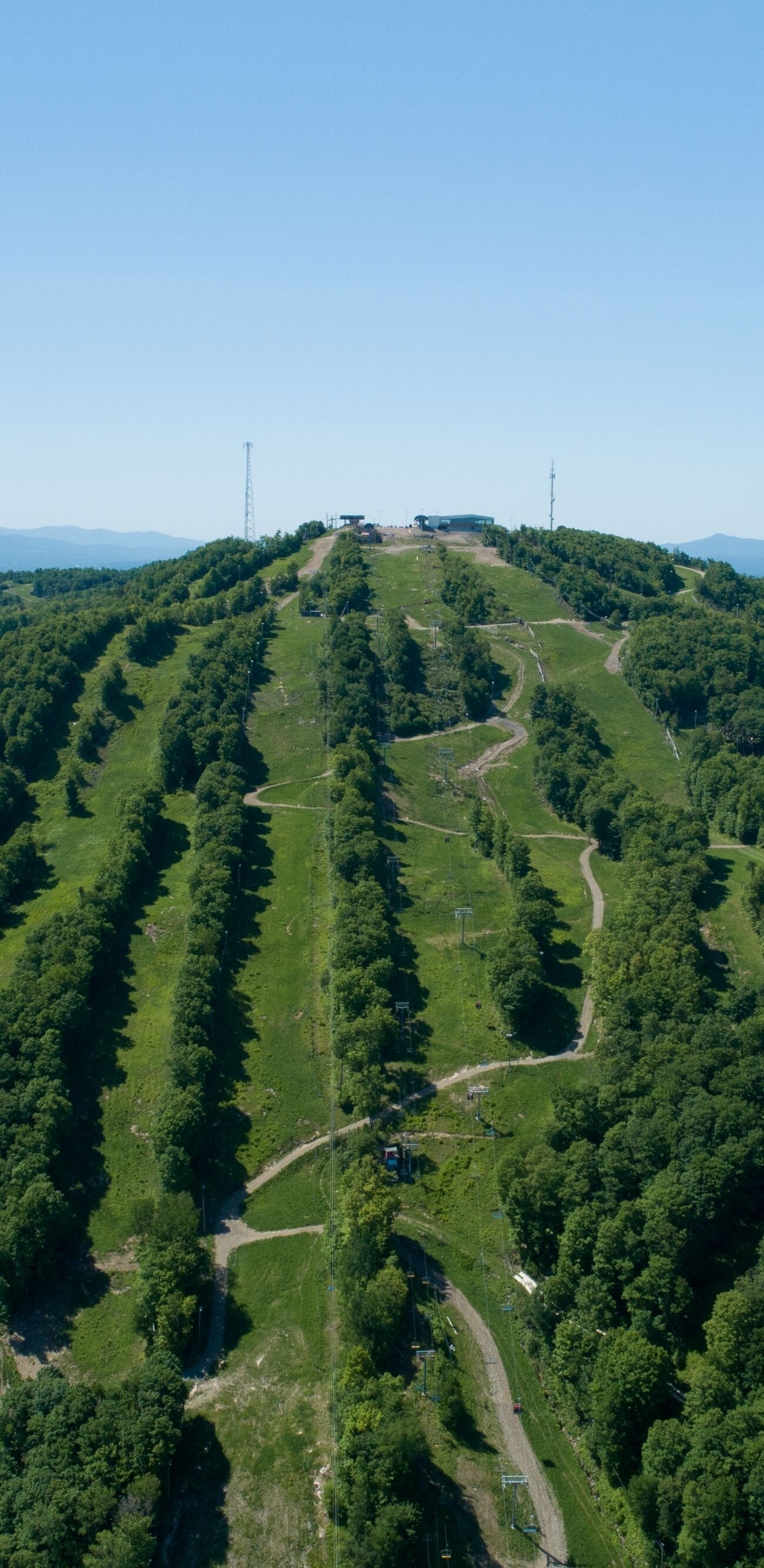 Aerial view of green mountain trails,