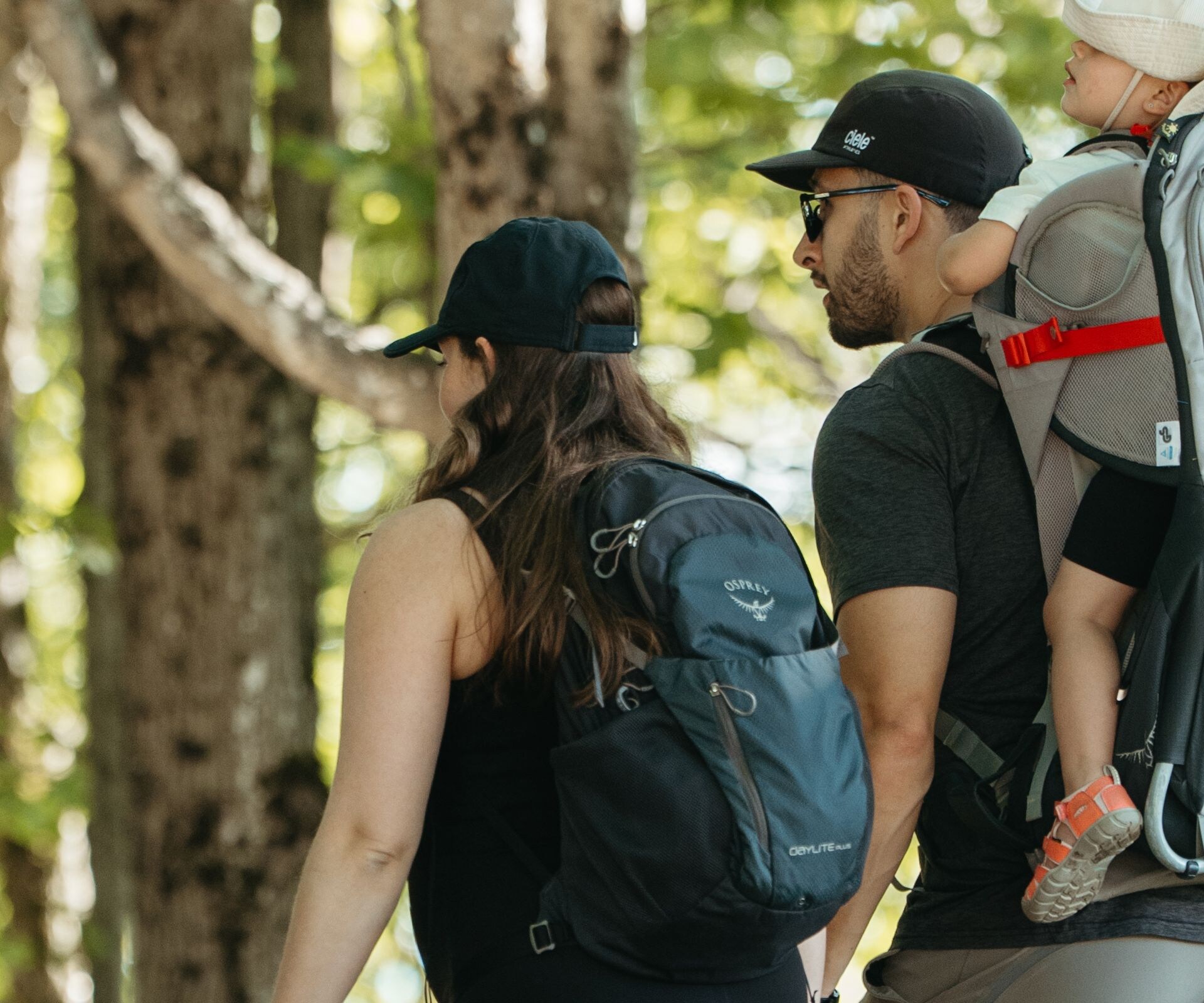 Family hiking wooded trail