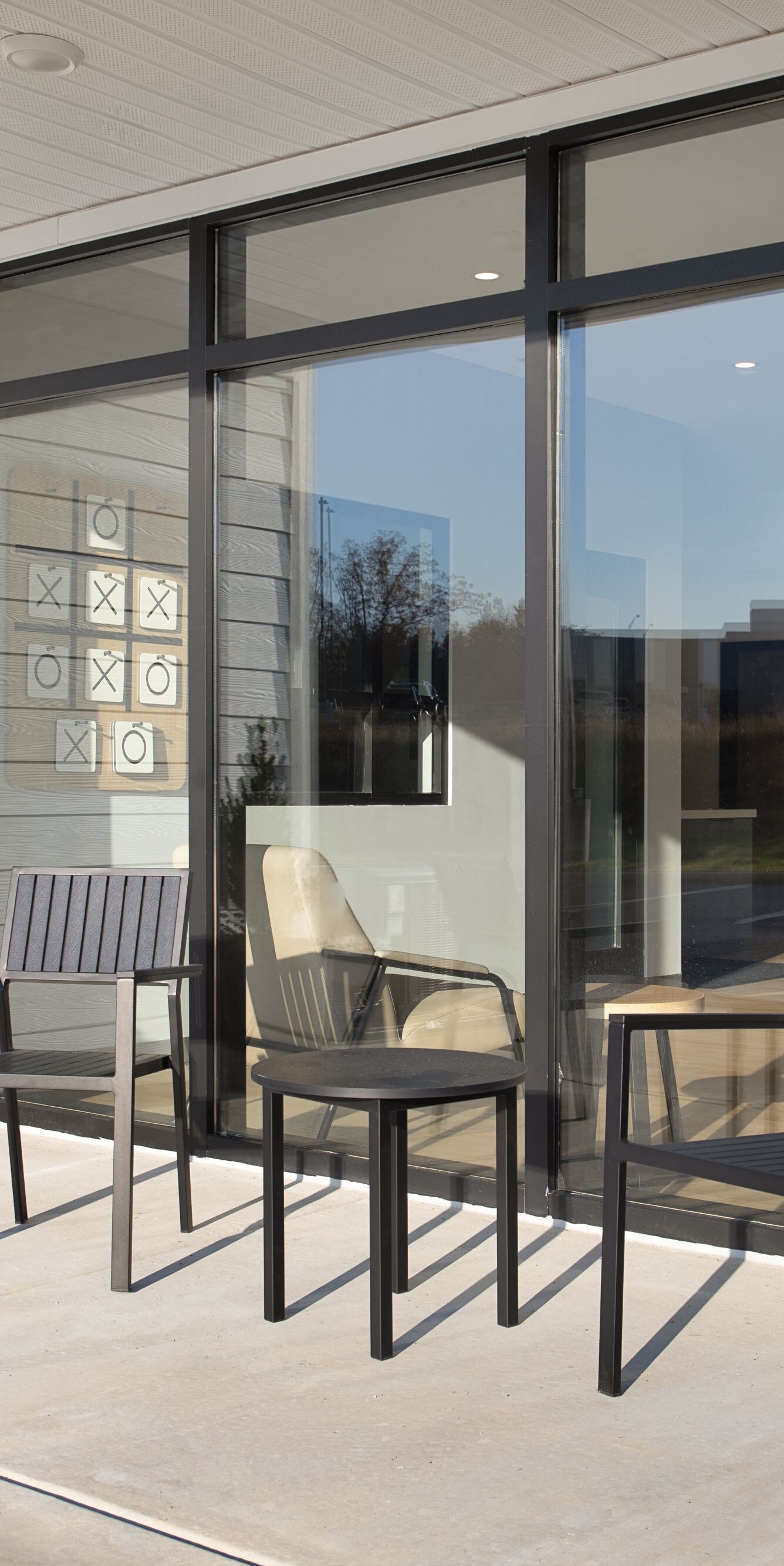 Outdoor patio with table, chairs, and planters