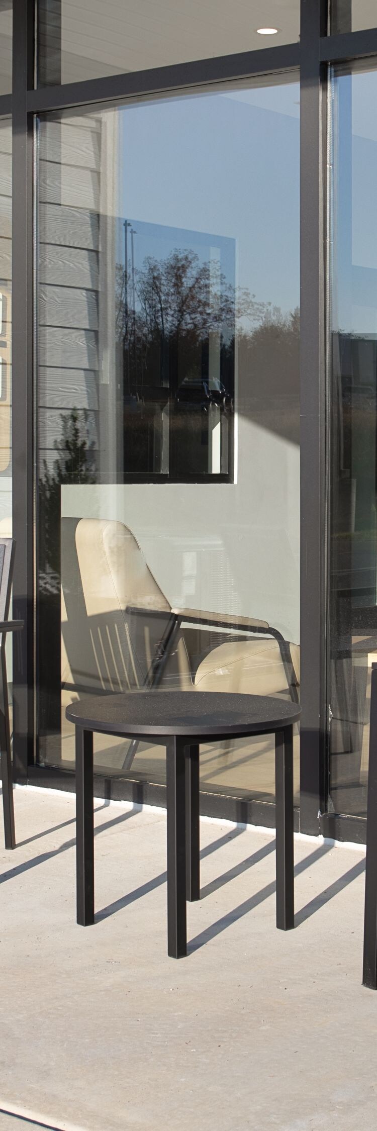 Outdoor patio with table, chairs, and planters