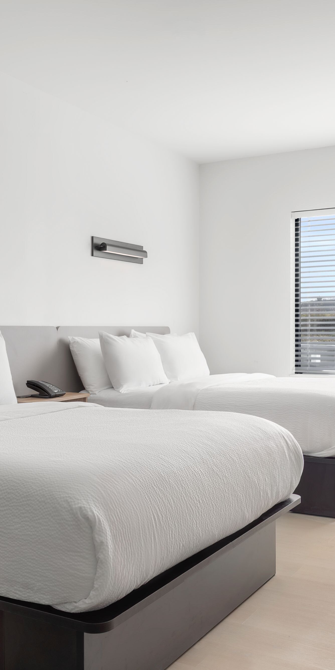 Double-queen guest room with beds