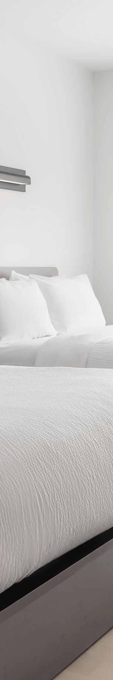 Double-queen guest room with beds