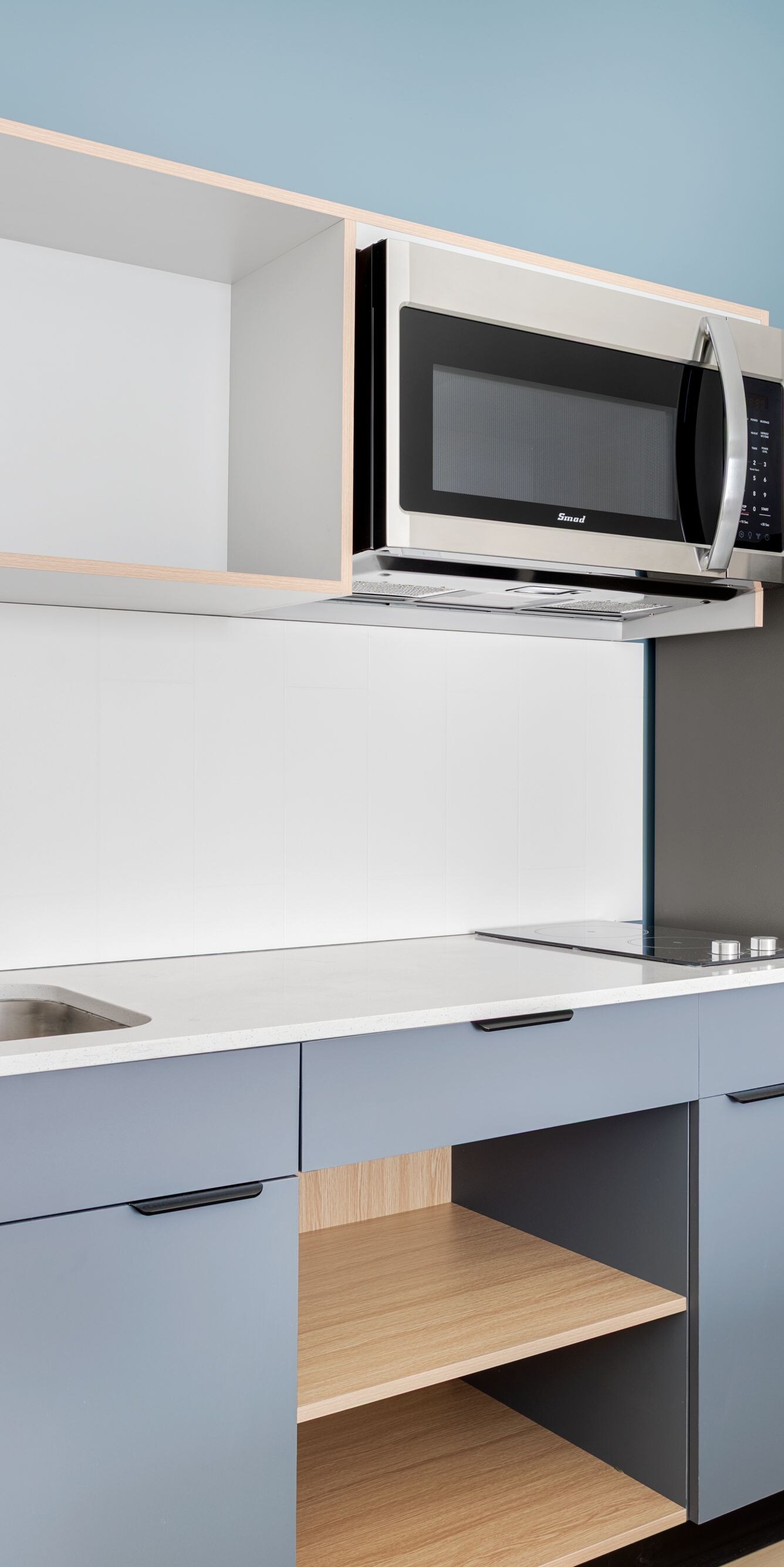 Guest room kitchenette with sink and microwave