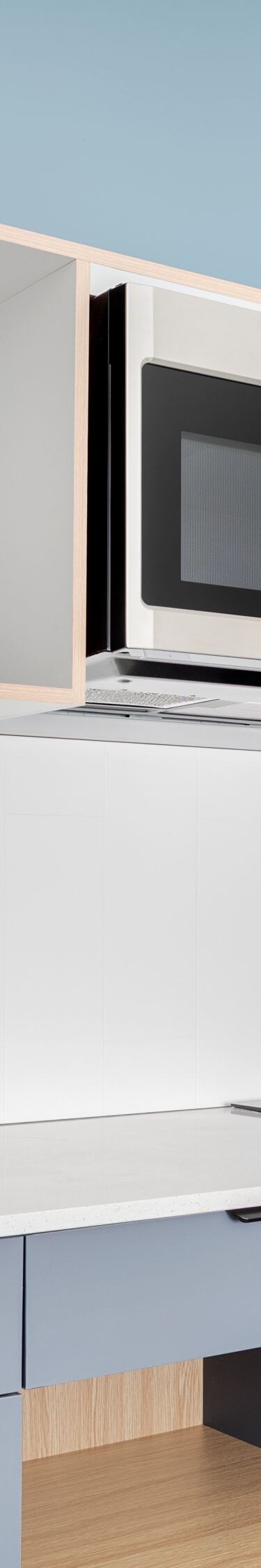 Guest room kitchenette with sink and microwave