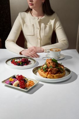 woman at table with assortment of dishes
