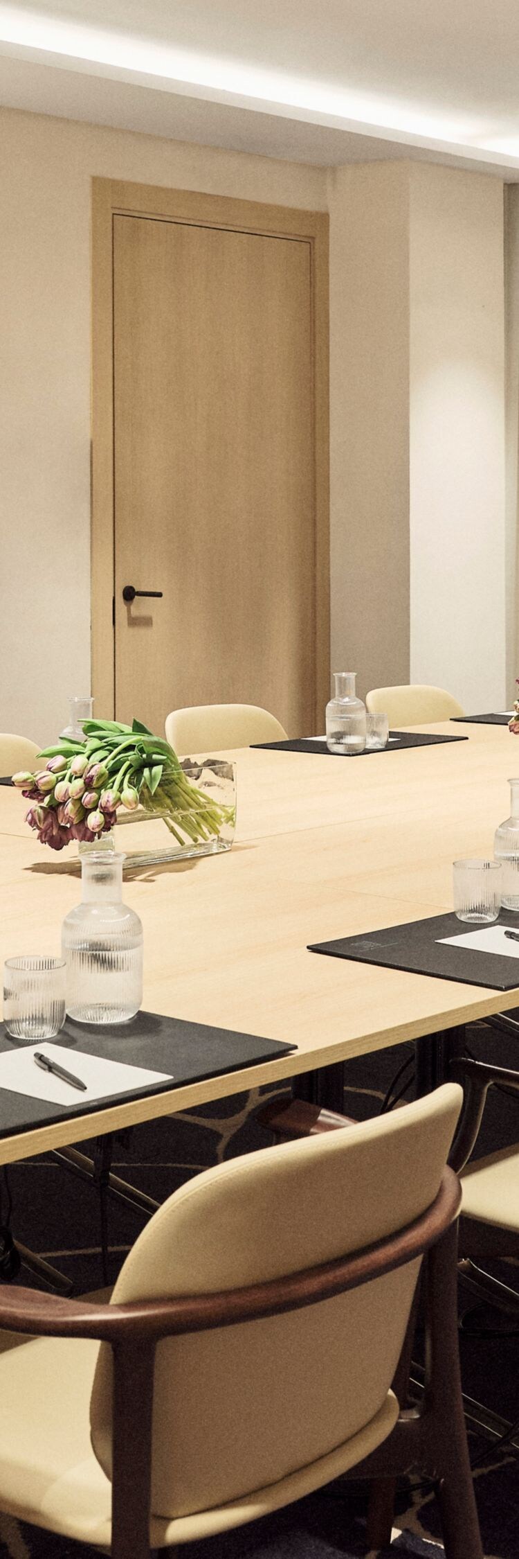 Meeting room with a  table, chairs
