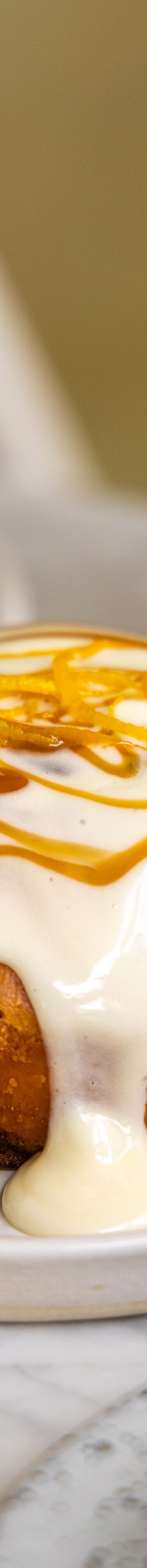 Pastry with icing and caramel topping