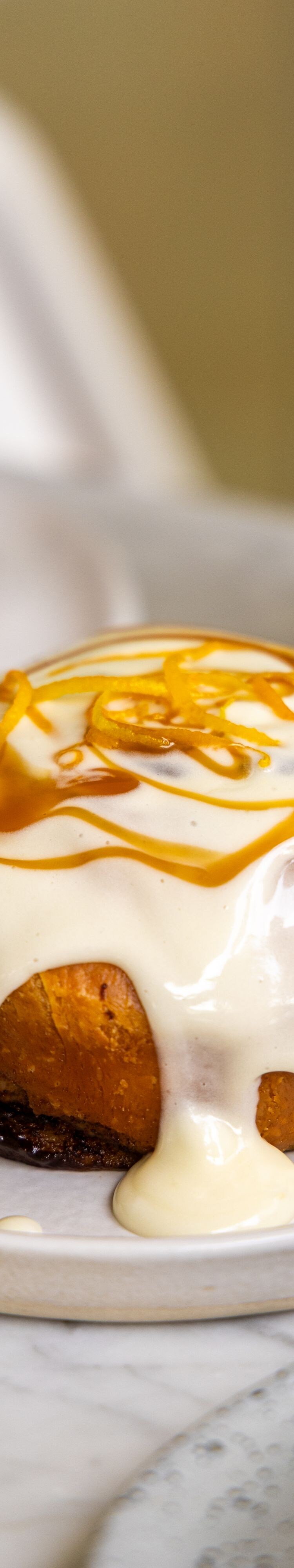 Pastry with icing and caramel topping