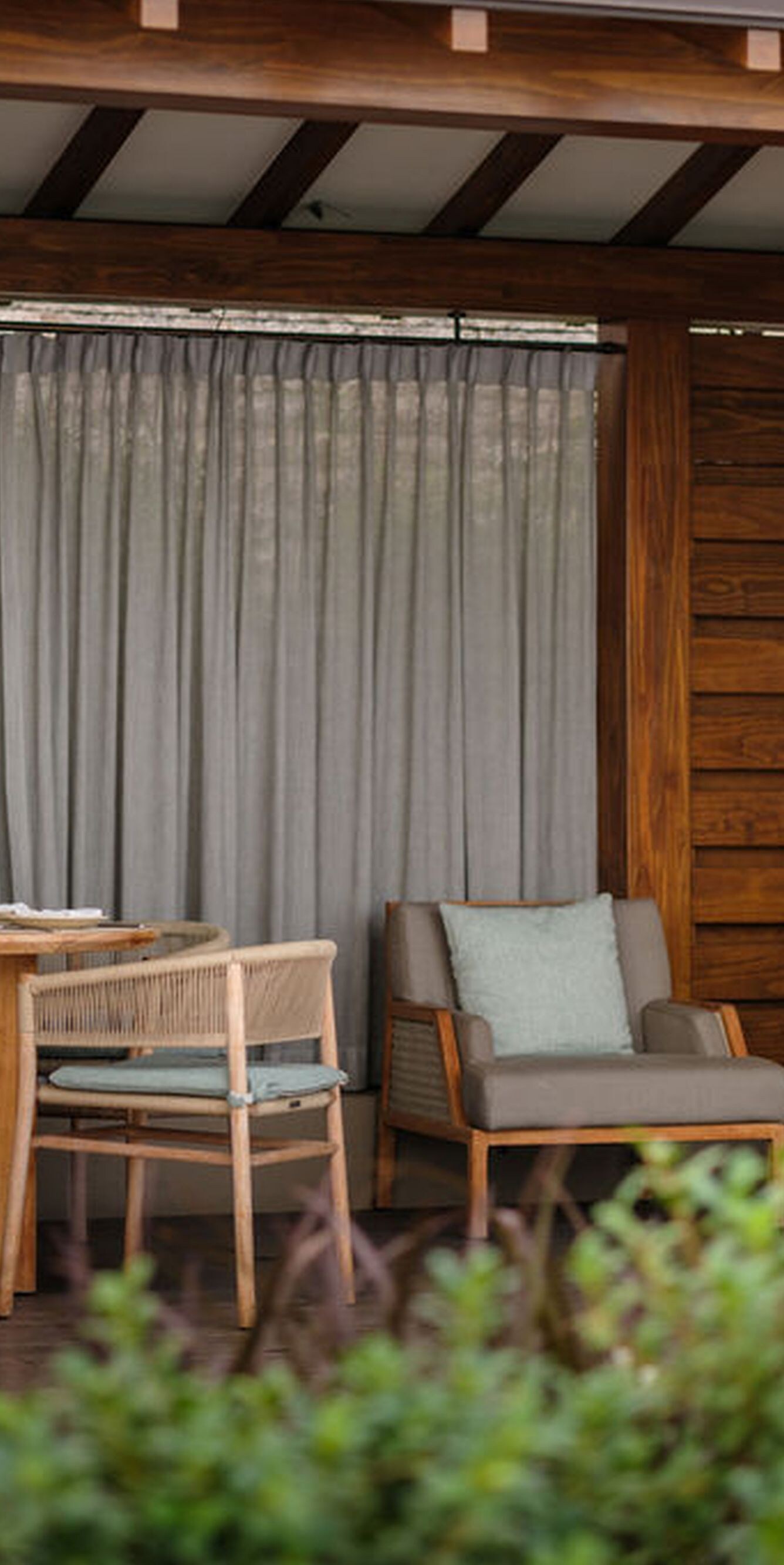 Private pool cabana with lounge seating and a dini