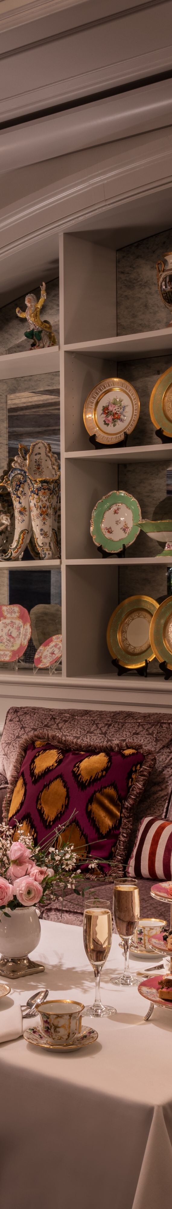 low tables set for tea in front of couches 