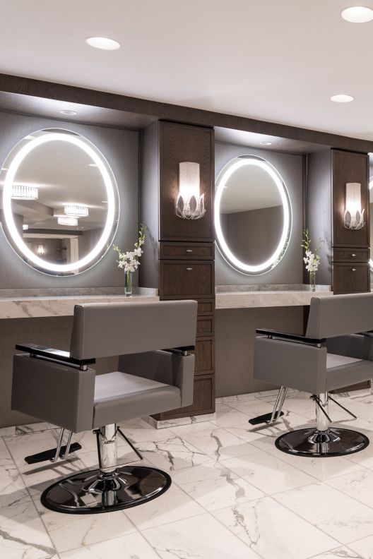 Hair salon with four chairs in front of mirrors