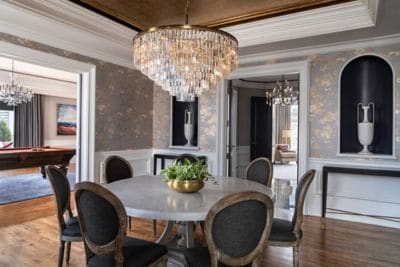 A suite dining room with crystal chandelier, seven