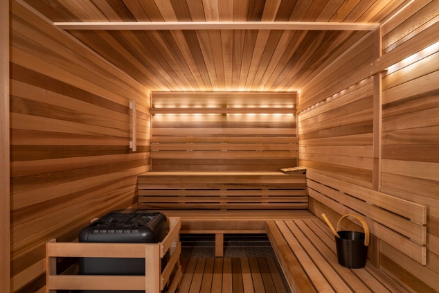 Wooden paneled sauna, light from back