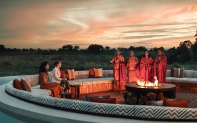 Guests enjoy Maasai storytelling by the firepit