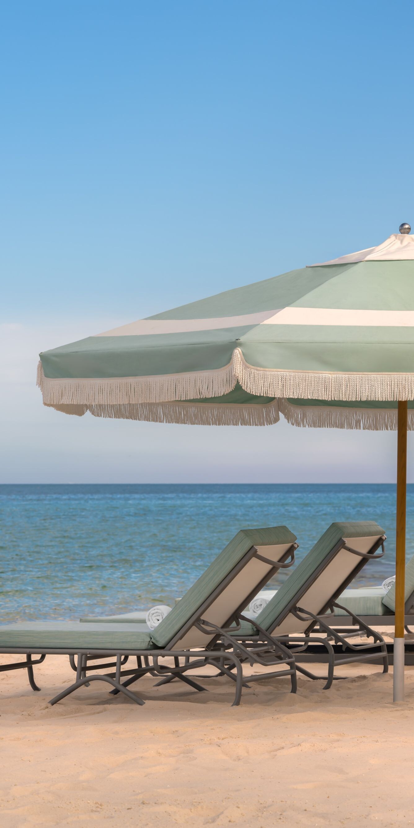 Beach Umbrella with lounge chairs overlooking the 