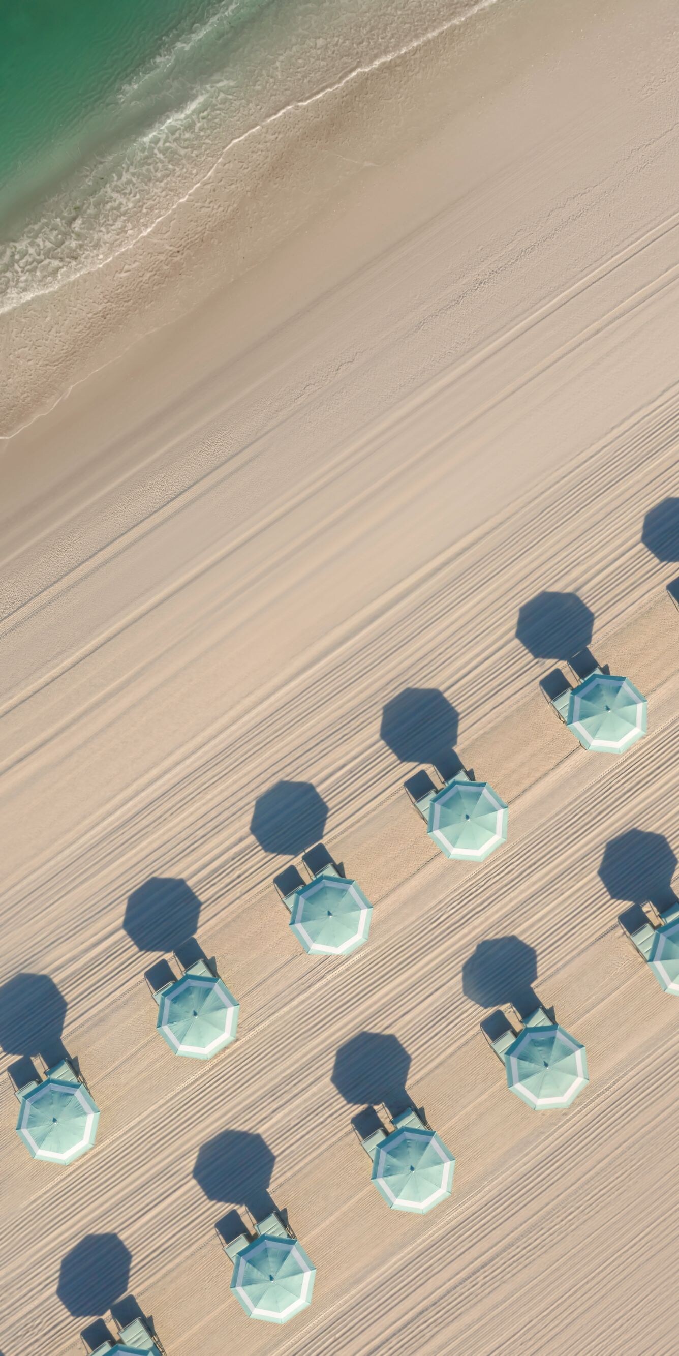 View of Beach Umbrellas with their shadows 