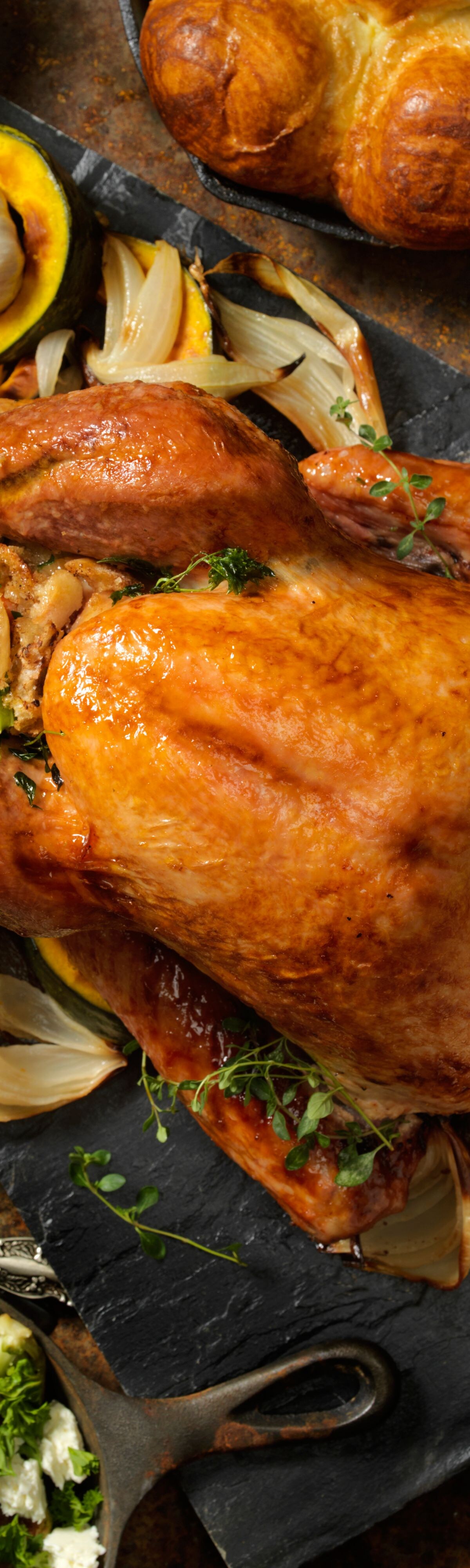 Roast turkey with vegetables on a festive table
