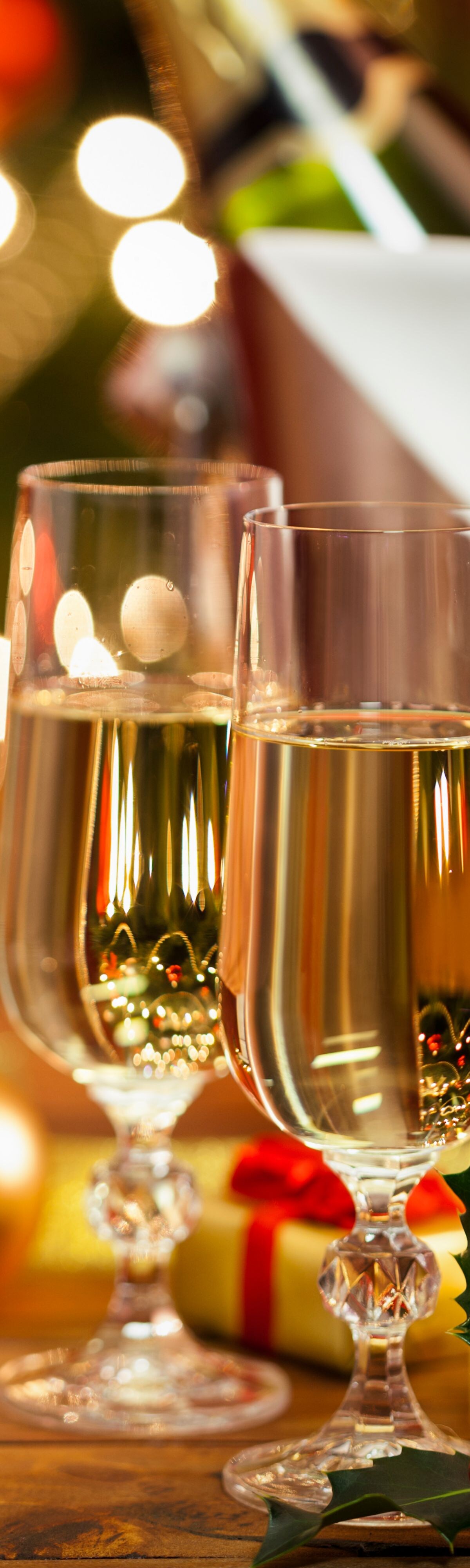 Champagne glasses with holiday décor